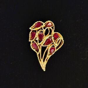 Gold trim brooch red gems bouquet
